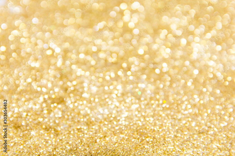 Defocused gold glitter background. Gold abstract bokeh background. Christmas abstract background. Defocused gold glitter background. Gold abstract bokeh background. Christmas abstract background.