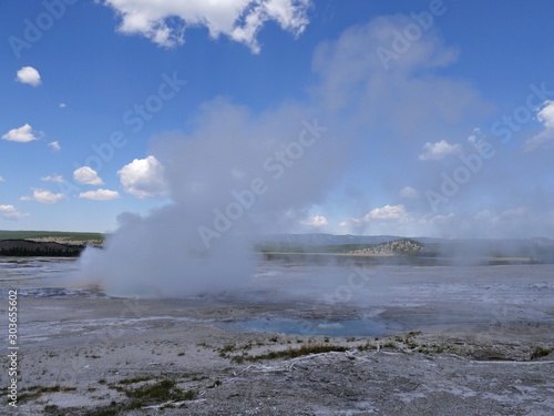 Breathtaking view of steam rising from the Clepsydra Geyser at the Lower Geyser Basin, Yellowstone National Park.