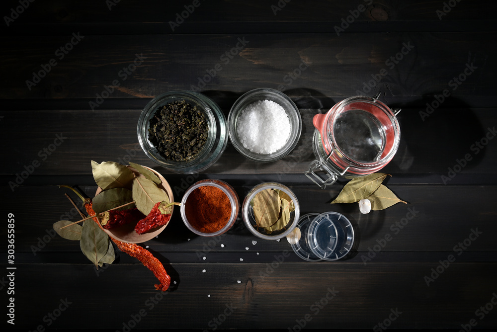Spices in jars on the kitchen shelf Spices in jars on the kitchen shelf