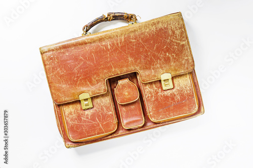 Old leather briefcase in white background