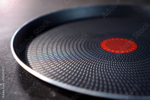Teflon pan with non-stick coating close up on a cuisine table photo