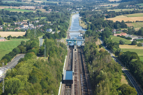 Belgium - Wallonia - Braine-le-Comte - The aerial panoramic view of downstream of Ronquieres inclined plane with one of its caissons mounted on rails full of water and surrounding fields and villages photo
