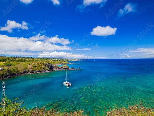 Landscape of Honolua Bay in Maui Hawaii. Honolua Bay located north of Kapalua, West Maui Hawaii, United States. Snorkeling paradise coral reefs in marine preserve. photo