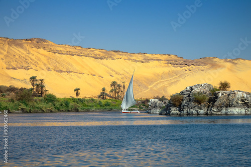 Obraz na płótnie Beautiful landscape with felucca boat on Nile river near Aswan, Egypt