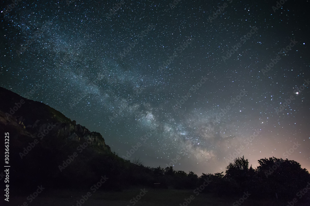 Naklejka night photo of the mountains, Milky Way over the sea, the starry sky