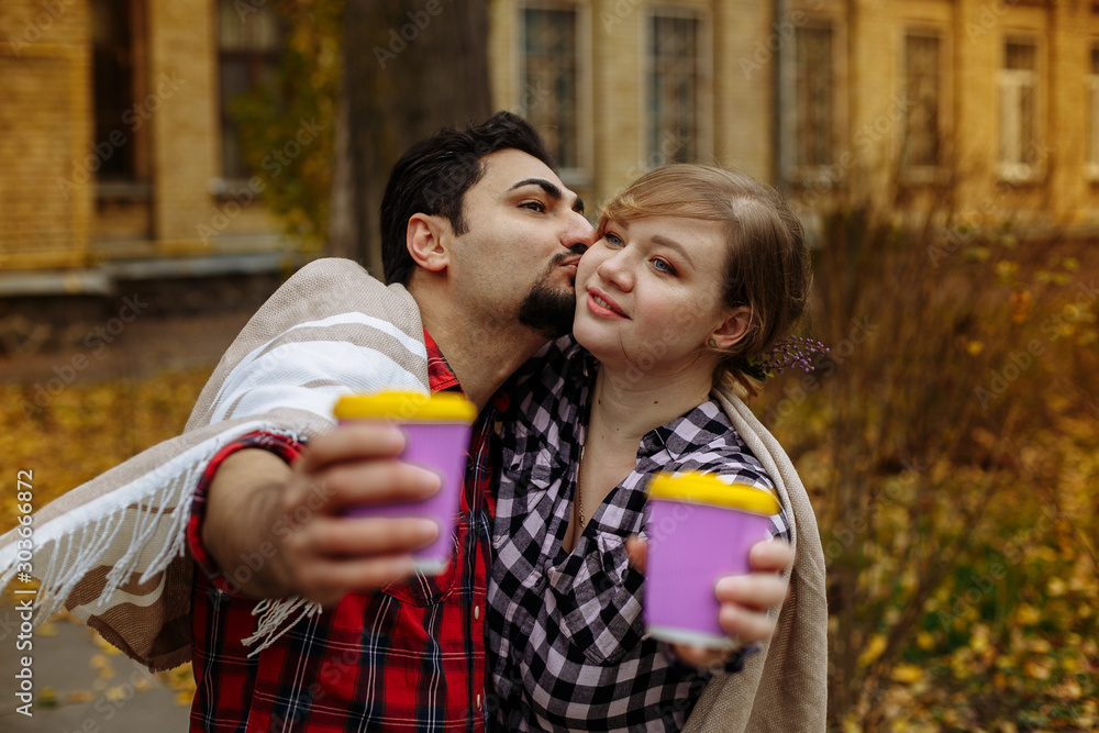 Fototapeta premium lovers smile and drink coffee