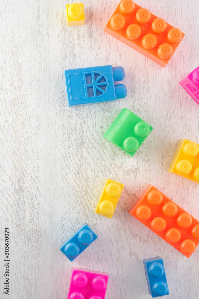 details of the children's designer of different colors and shapes on a wooden tabletop. Flat lay. horizontal orientation details of the children's designer of different colors and shapes on a wooden tabletop. Flat lay. horizontal orientation