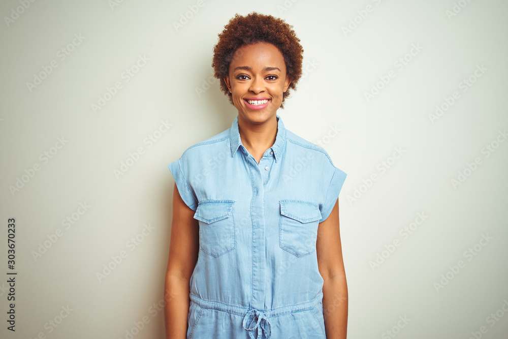 Young beautiful african american woman with afro hair over isolated background with a happy and cool smile on face. Lucky person. Young beautiful african american woman with afro hair over isolated background with a happy and cool smile on face. Lucky person.