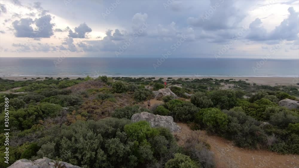 Panoramic view of the Mediterranean coast with a cloudy sky in the evening of a summer day. Patara Beach in Turkey. Natural landscape Panoramic view of the Mediterranean coast with a cloudy sky in the evening of a summer day. Patara Beach in Turkey. Natural landscape