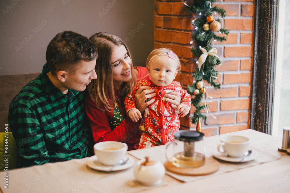 Happy family having holiday breakfast on Christmas. Happy family having holiday breakfast on Christmas.