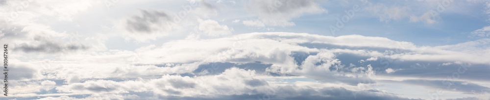 Cloudy sky natural background. Super wide angle panorama, banner format Cloudy sky natural background. Super wide angle panorama, banner format