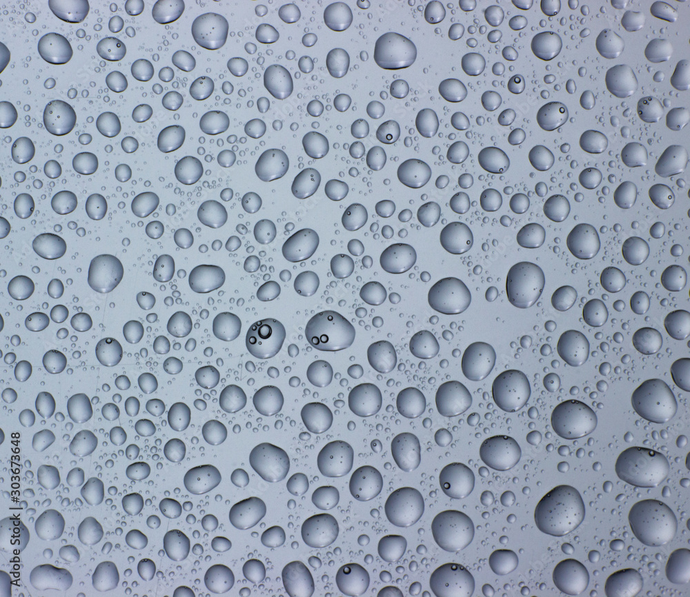 Drops of water on clear glass. Window background with dew. Drops of water on clear glass. Window background with dew.