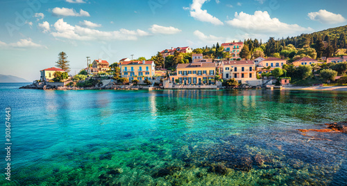 Perfect summer cityscape of Fiskardo town with Zavalata Beach. Stunning morning seascape of Ionian Sea. Superb outdoor scene of Kefalonia island, Greece, Europe. Traveling concept background.
