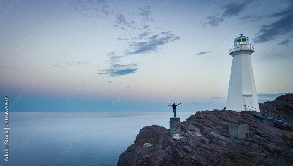 Fototapeta premium Lighthouse over the clouds