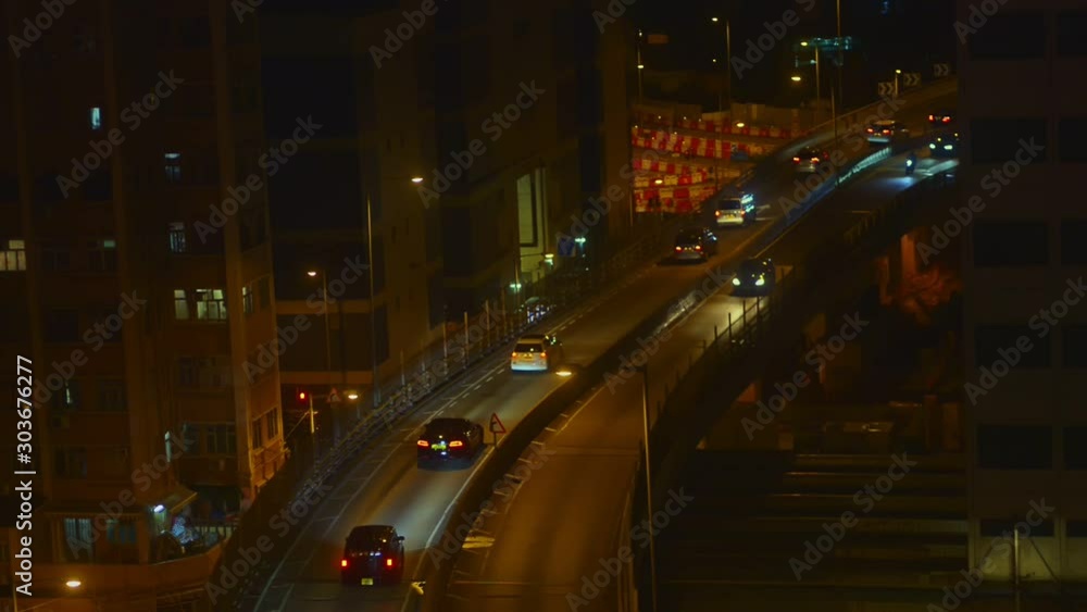 Nightlife and cars moving in street road asian metropolis on summer. Transport and architecture in downtown of chinese city. Beautiful cityscape and traffic in town in dark evening. Concept: Asia Nightlife and cars moving in street road asian metropolis on summer. Transport and architecture in downtown of chinese city. Beautiful cityscape and traffic in town in dark evening. Concept: Asia