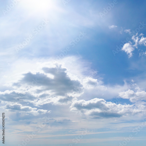 Bright summer sun on blue sky © Serghei V