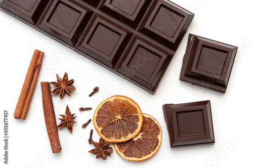 dark chocolate, dried orange, anise, cinnamon, cloves - composition. view from above. isolated on white background.