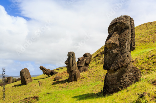 Moai statues in the Rano Raraku Volcano in Easter Island, Rapa Nui National Park, Chile photo
