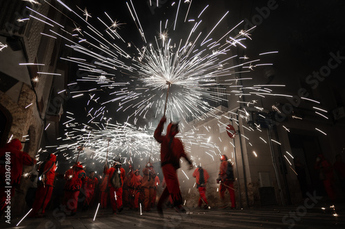 Fireworks called correfocs, a traditional performance of catalan culture photo