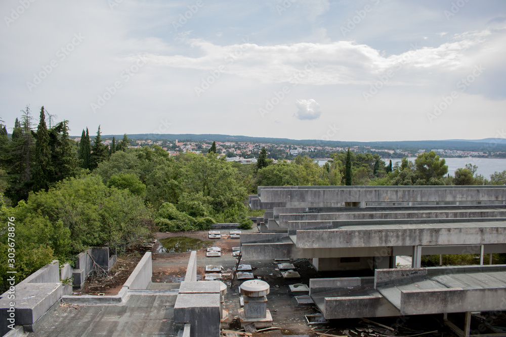 Krk, Croatia, July 12 2019: Abandoned and destructed luxury hotel Palace Haludovo in Malinska, Island of Krk, Croatia. In 1970's and 1980's it was the most exclusive hotel in Eastern Europe. Krk, Croatia, July 12 2019: Abandoned and destructed luxury hotel Palace Haludovo in Malinska, Island of Krk, Croatia. In 1970's and 1980's it was the most exclusive hotel in Eastern Europe.