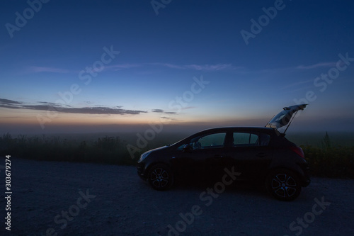 car in the night in the field, backlight © vadimborkin