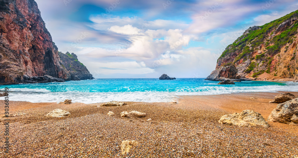 Gorgeous spring view of Gyali beach. Panoramic morning seascape of Ionian Sea. Fantastic outdoor scene of Corfu island, Greece, Europe. Beauty of nature concept background.