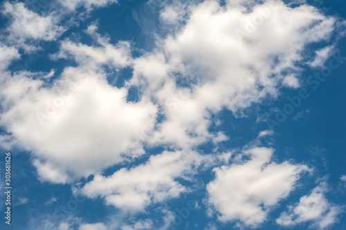blue sky background with tiny clouds