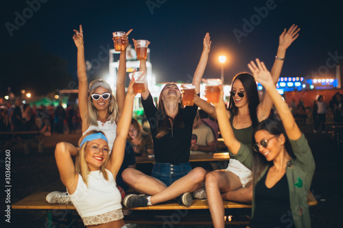 Female friends enjoying their night at the festival