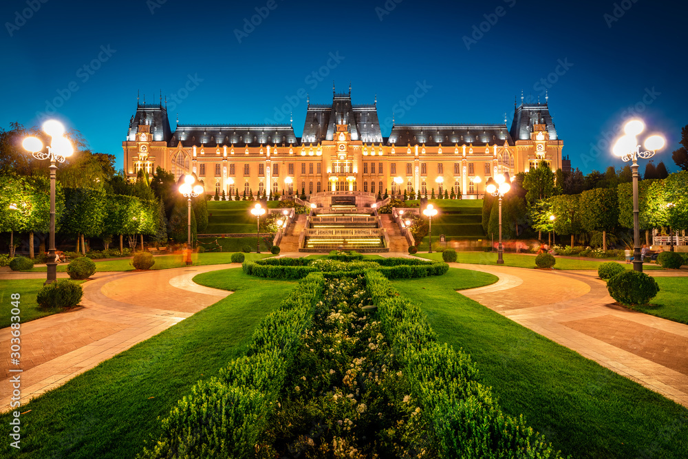 Wonderful night view of Cultural Palace Iasi. Fantastic summer cityscape of Iasi town, capital of  Moldavia region, Romania, Europe. Architecture traveling background.