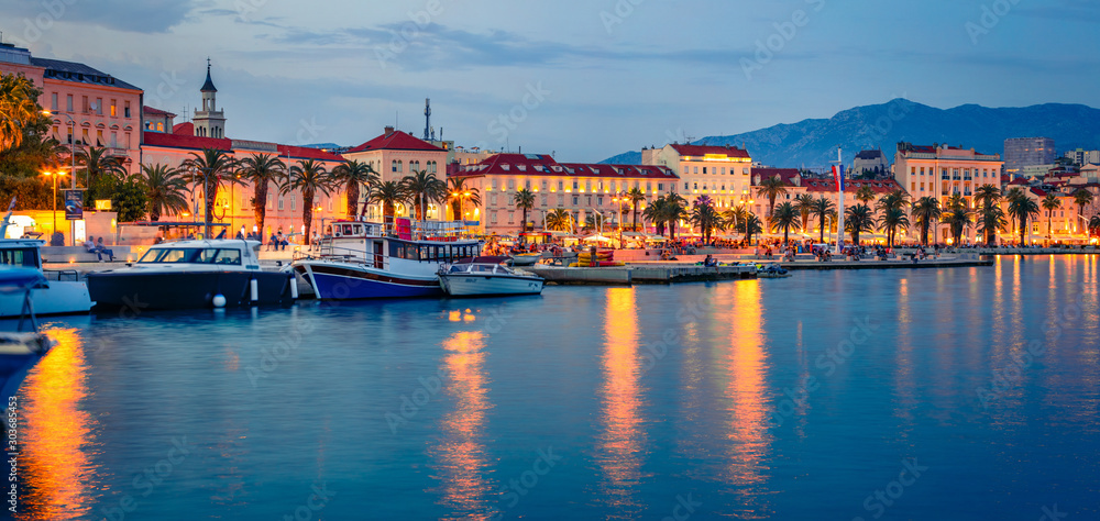 Panoramic evening cityscape of Split town. Captivating summer sunset in Croatia, Europe. Beautiful world of Mediterranean countries. Traveling concept background.