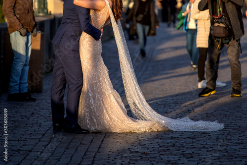 couple hugging and posing in front of the photographer