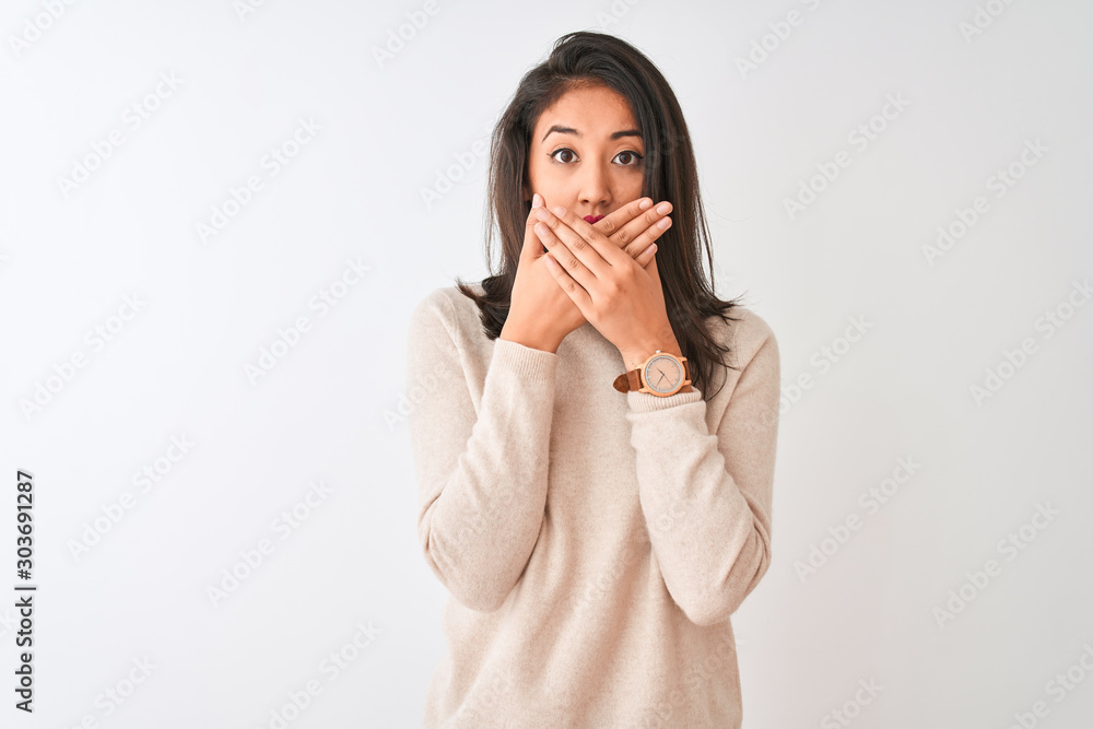 Beautiful chinese woman wearing turtleneck sweater standing over isolated white background shocked covering mouth with hands for mistake. Secret concept. Beautiful chinese woman wearing turtleneck sweater standing over isolated white background shocked covering mouth with hands for mistake. Secret concept.