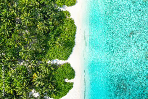 Aerial top down view with drone of an tropical exotic island paradise with turquoise crystal clear water and pure white sand beach