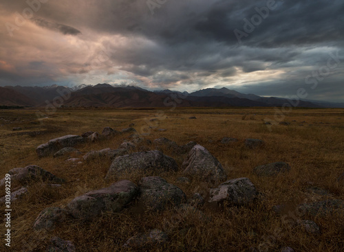 foothills at sunset, mountain ranges of Kyrgyzstan photo