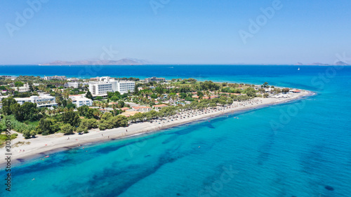 Panoramic aerial view of a Mediterranean island Kos in Greece Lambi coastline touristic area with crystal clear water on a sunny summer day © Tadej