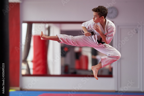 Young karate student executing a kata
