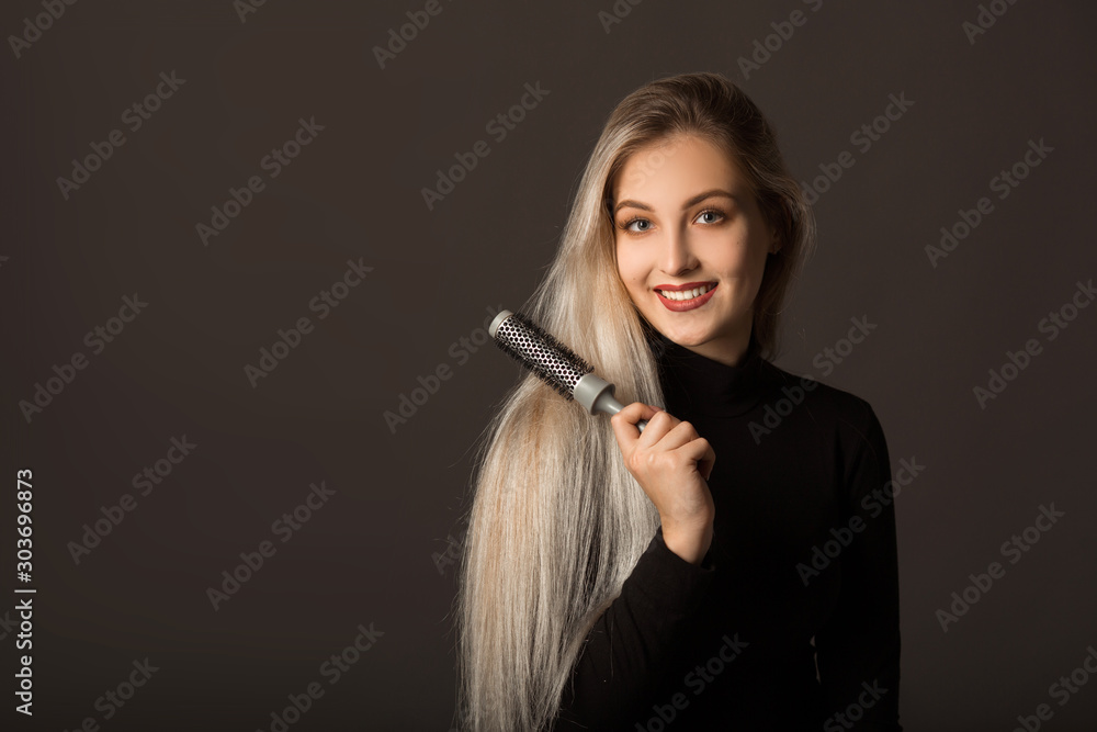 beautiful young woman with long hair on a black background beautiful young woman with long hair on a black background