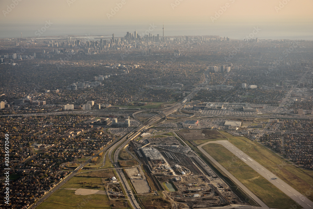 Downsview Airport and Yorkdale Shopping Centre in North York with Toronto city skyline of highrise towers