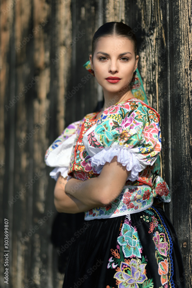Fototapeta premium Beautiful woman wearing traditional slovak folk costumes. .