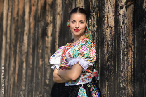 Beautiful woman wearing traditional slovak folk costumes. .