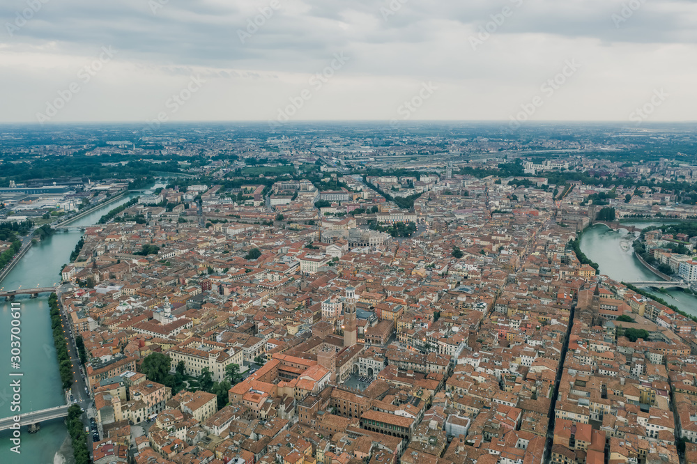 Aerial drone shot view of city of Verona with adige river around
