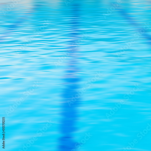 Blue water and laens in swimming pool