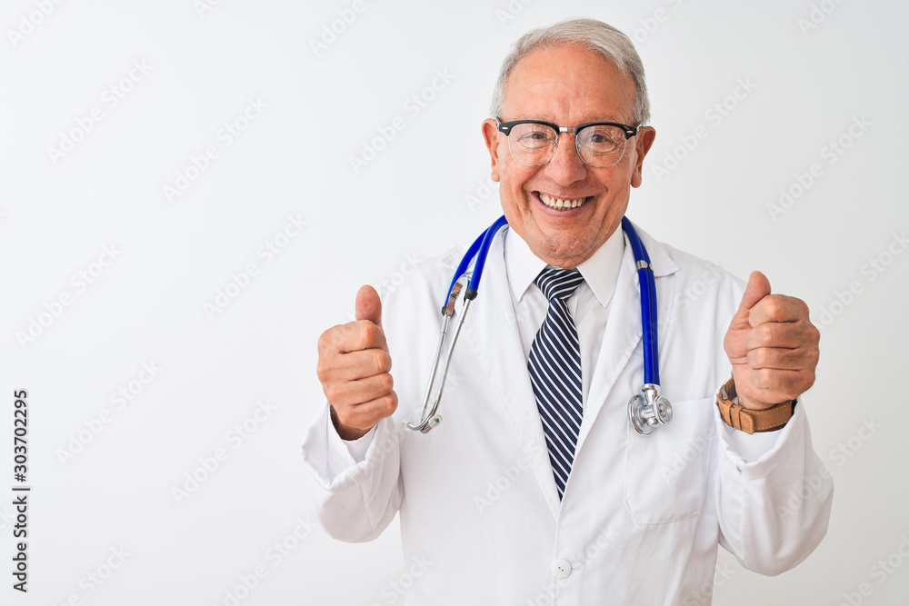 Senior grey-haired doctor man wearing stethoscope standing over isolated white background excited for success with arms raised and eyes closed celebrating victory smiling. Winner concept. Senior grey-haired doctor man wearing stethoscope standing over isolated white background excited for success with arms raised and eyes closed celebrating victory smiling. Winner concept.