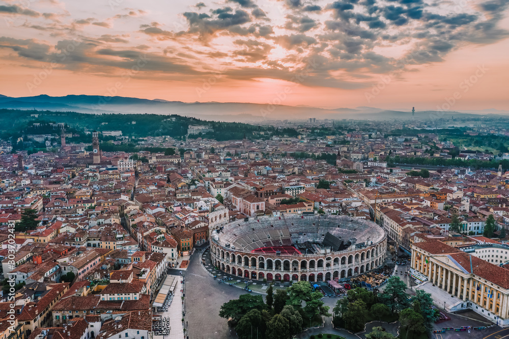 Aerial drone shot view of amphitheatre Verona Area in historic old city center at sunrise