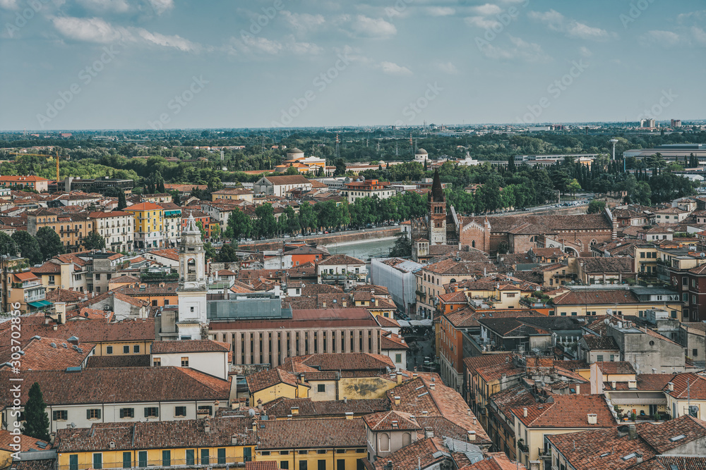Top view of red brick city skyline from torre dei lamberti tower in Verona, Italy