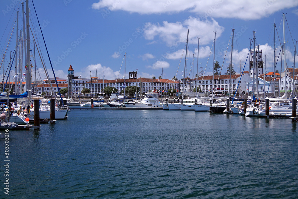 Ponta Delgada harbour with sails and typical architecture
