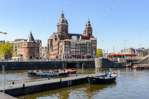 Photography Sightseeng at Canal Boats near the Central Station of Amsterdam