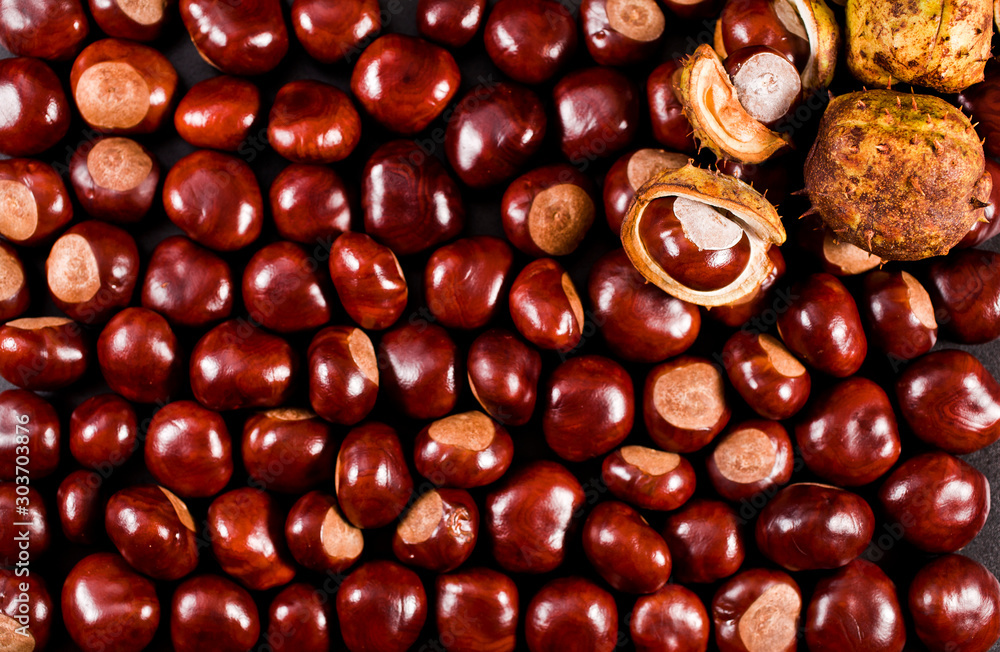 Background of peeled and unpeeled chestnuts. Top view. Background of peeled and unpeeled chestnuts. Top view.