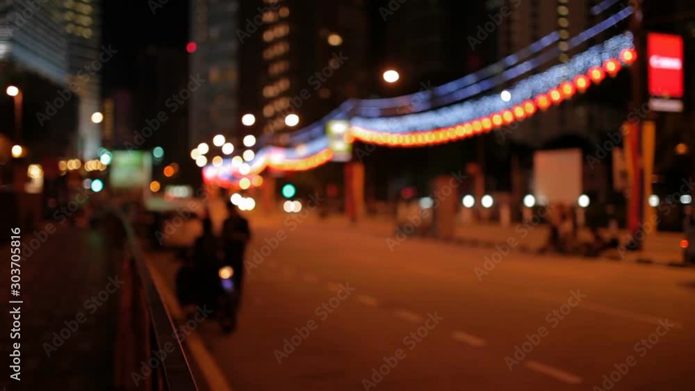 Urban background with blurred lantern lights. Night street with transport traffic. Bangkok, Thailand. Urban background with blurred lantern lights. Night street with transport traffic. Bangkok, Thailand.