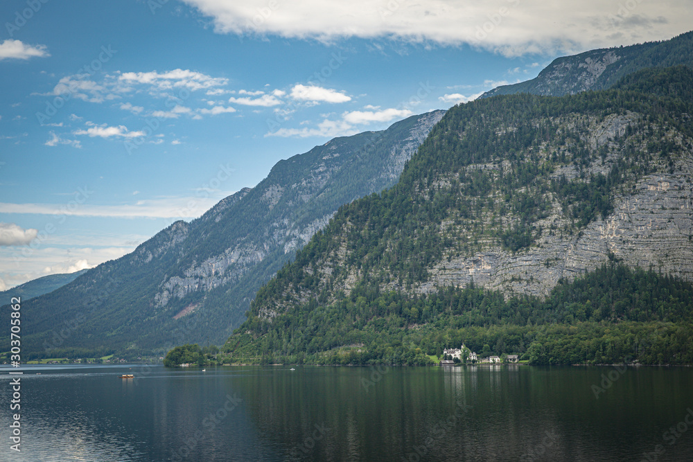 View on lake in austrian town hallstatt during tourist season in summer